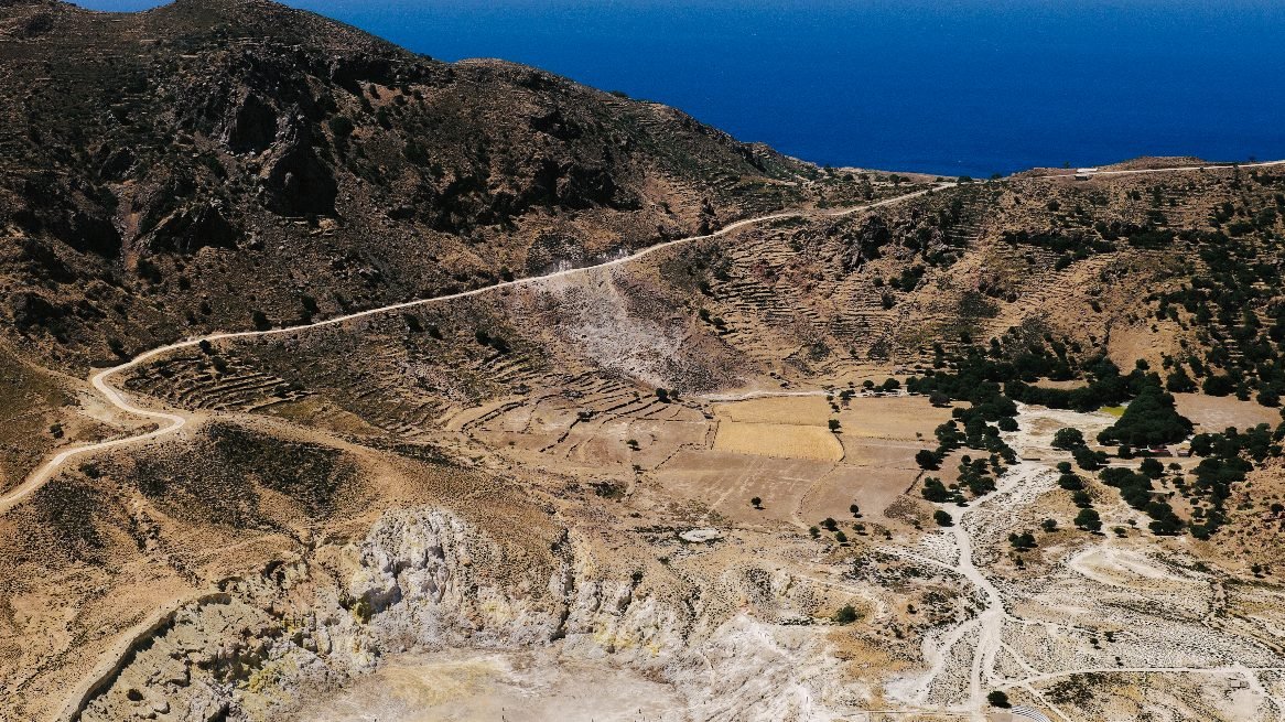 The pale sulphur floor of the Stefanos crater on Nisyros, seen from the rim above