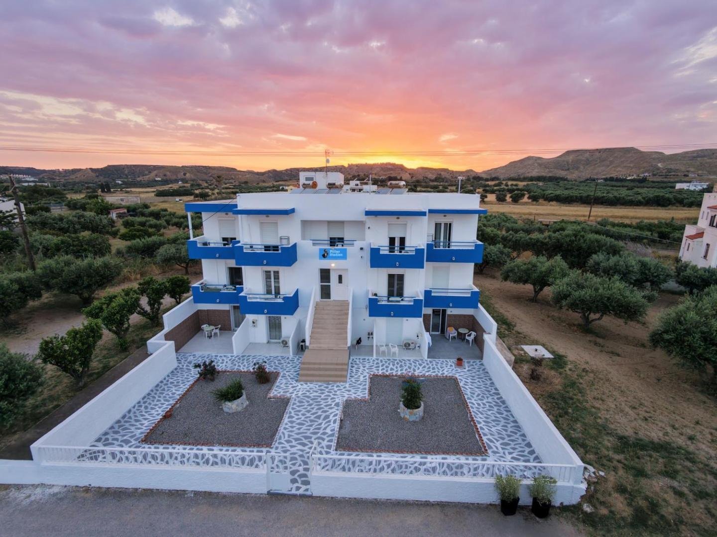 Pittas Studios at sunset, seen from above among the olive groves of Kardamena